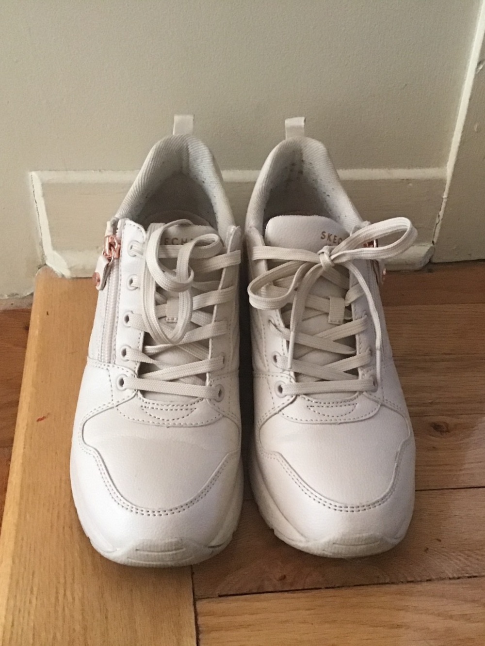 Sketchers with rose gold accents